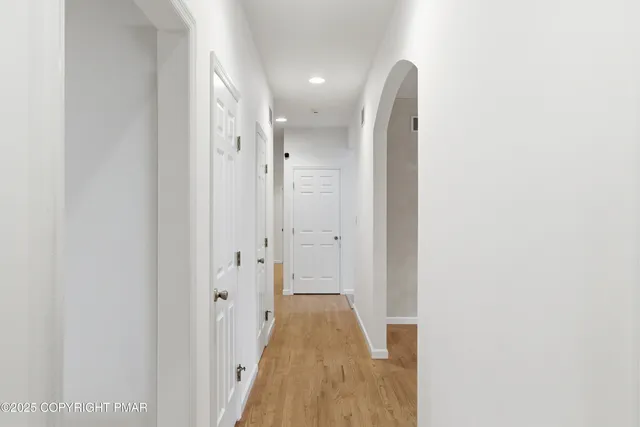a view of a bathroom with a sink and a mirror