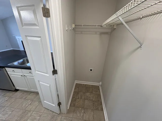 a view of a kitchen with refrigerator