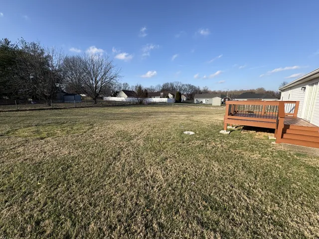 a view of deck with wooden floor and city view