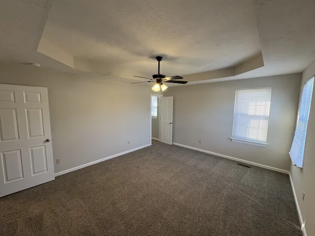 a bathroom with a sink and mirror with toilet
