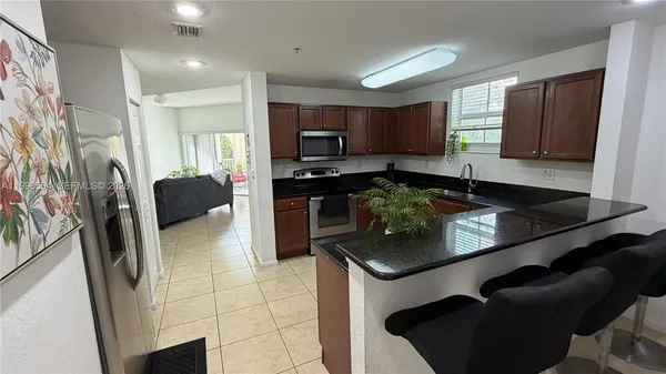 $450,000 | 11605 Northwest 89th Street, Unit 220, Doral, FL 33178