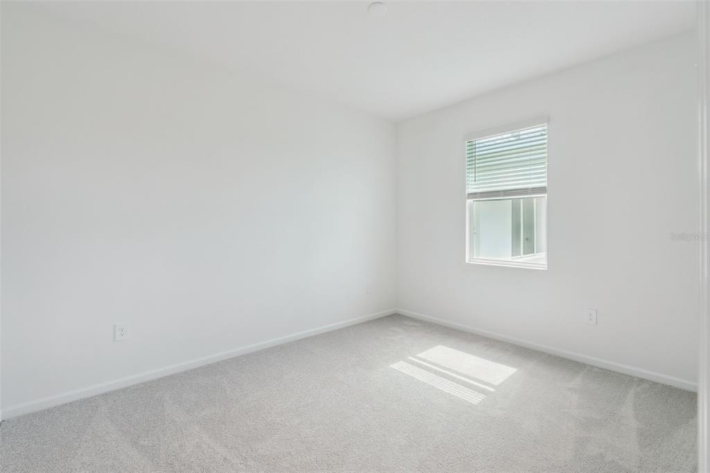 1672 Rider Rain Lane Apopka, FL 32703 - Photo 21 of 35 an empty room with a window