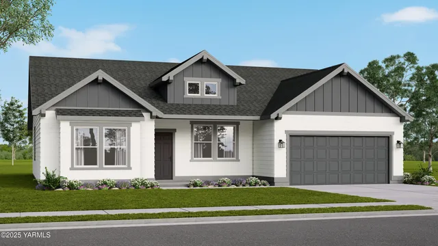 a front view of a house with a garden and garage