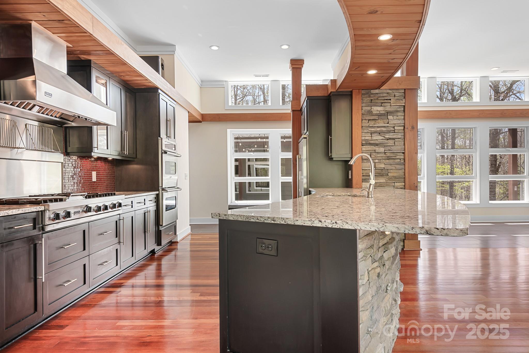3249 Ivey Creek Road Maiden, NC 28650 - Photo 22 of 45 a kitchen with stainless steel appliances granite countertop a stove and cabinets