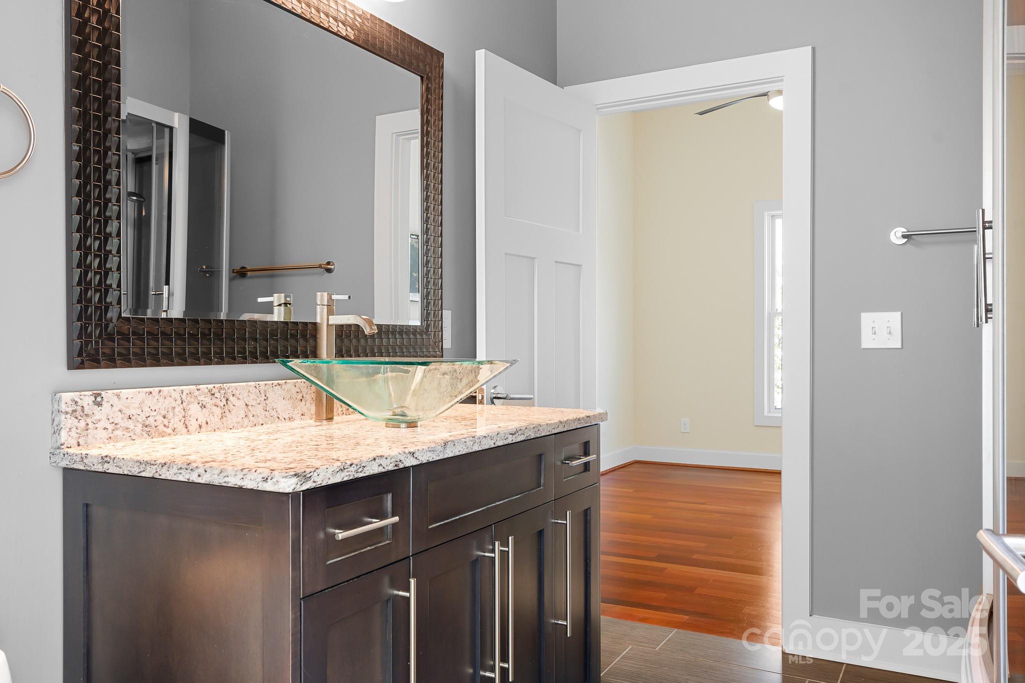 3249 Ivey Creek Road Maiden, NC 28650 - Photo 28 of 45 a bathroom with a granite countertop sink and a mirror