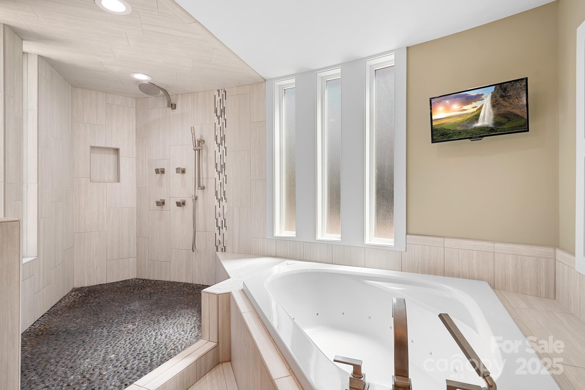 3249 Ivey Creek Road Maiden, NC 28650 - Photo 31 of 45 a spacious bathroom with a bathtub and a shower