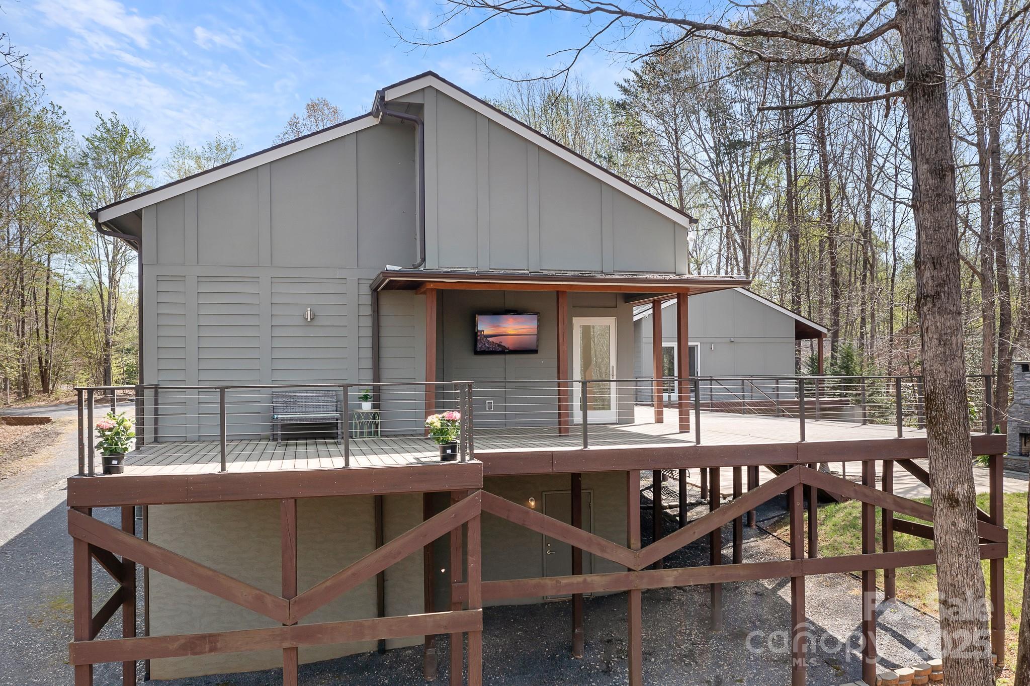 3249 Ivey Creek Road Maiden, NC 28650 - Photo 38 of 45 a backyard of a house with barbeque oven table and chairs