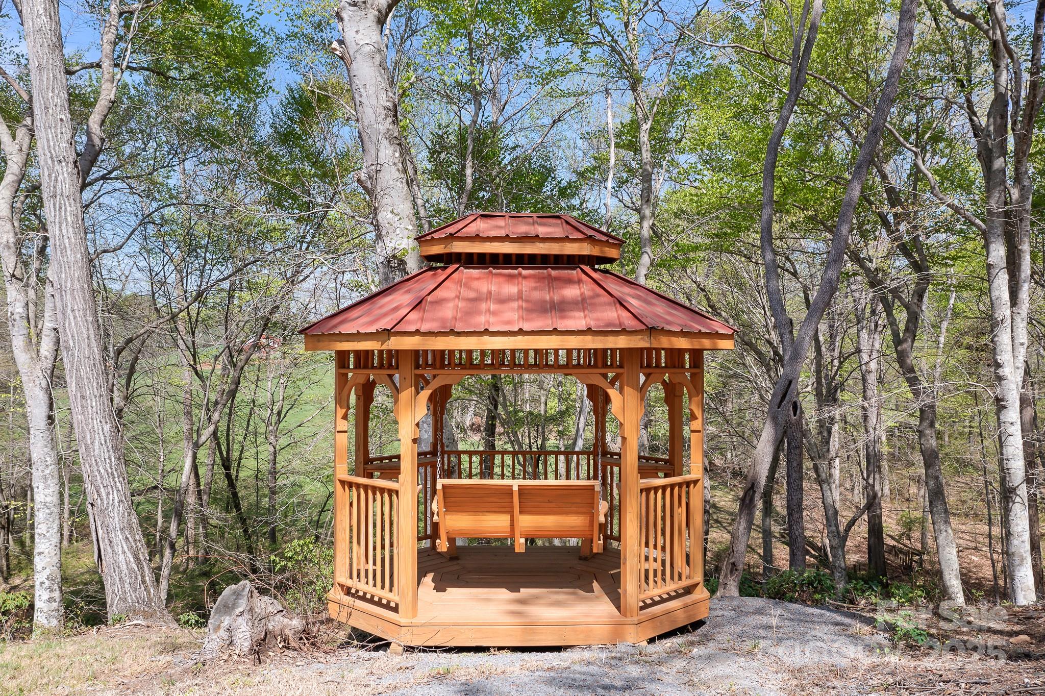 3249 Ivey Creek Road Maiden, NC 28650 - Photo 41 of 45 a view of a tiny house with yard and trees