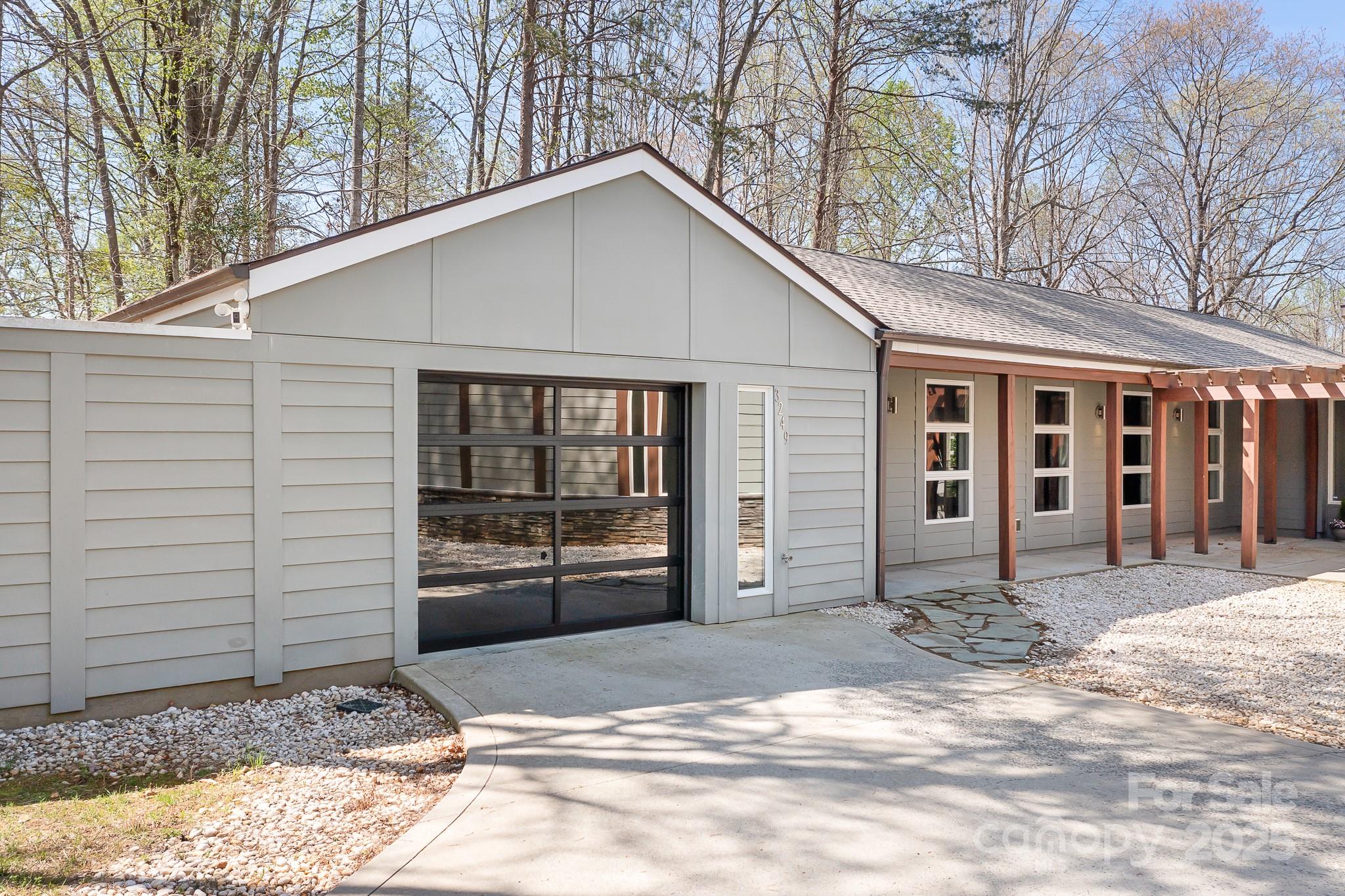 3249 Ivey Creek Road Maiden, NC 28650 - Photo 7 of 45 a view of a house with a yard and garage