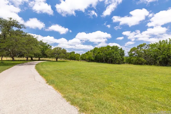 a view of a lake with a big yard