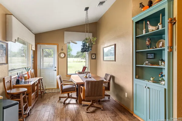 a kitchen with stainless steel appliances granite countertop a stove and a sink with dishwasher