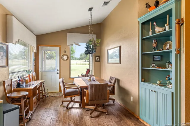 a kitchen with stainless steel appliances granite countertop a stove and a sink with dishwasher
