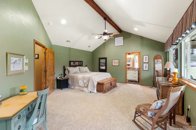 a spacious bathroom with a shower sink and mirror