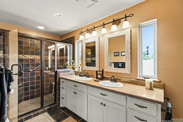 a bedroom with furniture and large windows