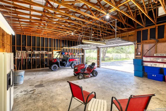 a front view of house with yard and lake