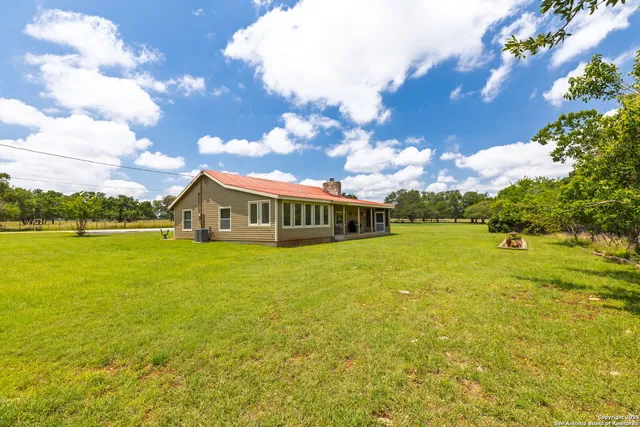 a view of a house with a big yard