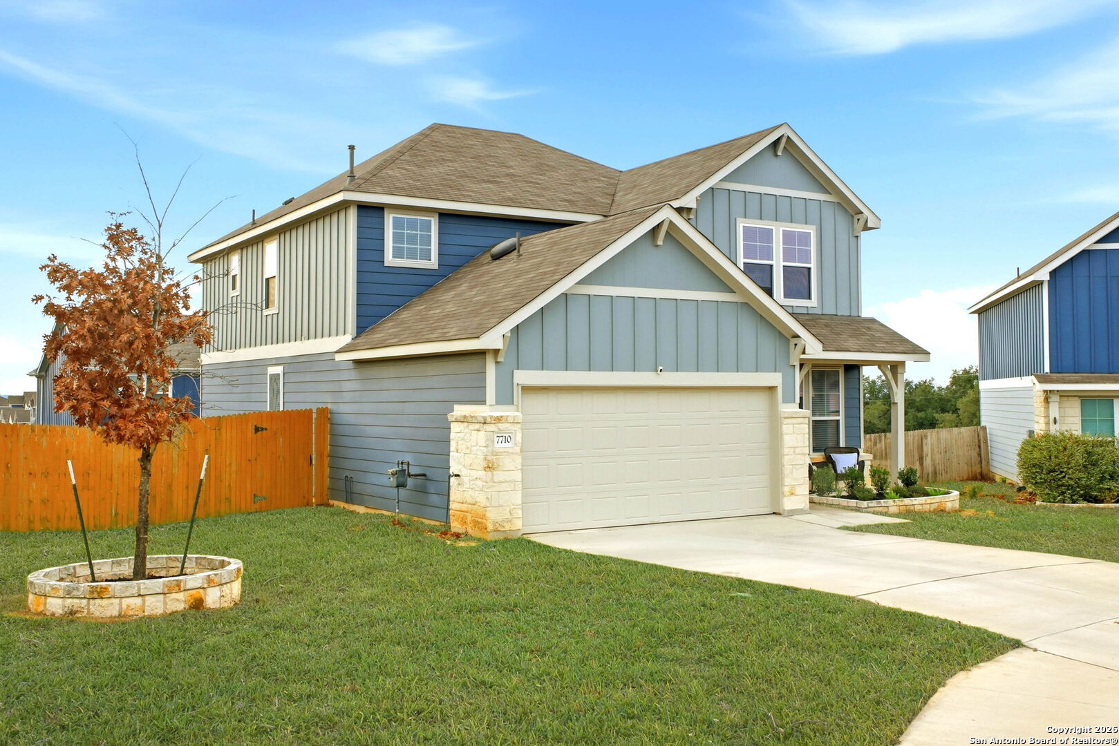 7710 Pecos Boerne, TX 78015 - Photo 2 of 34 a front view of a house with a yard