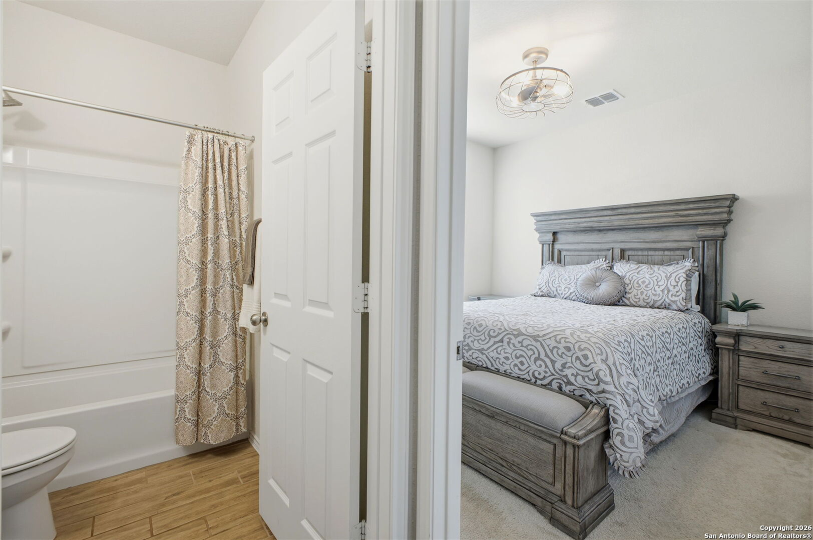 7710 Pecos Boerne, TX 78015 - Photo 23 of 34 a bedroom with a bed and a toilet