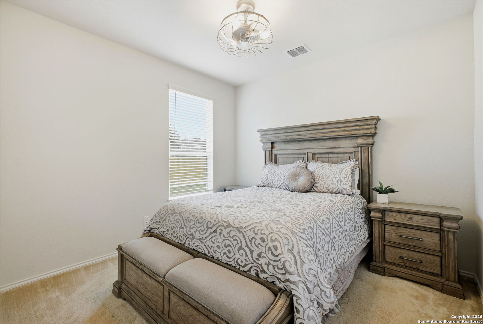 7710 Pecos Boerne, TX 78015 - Photo 24 of 34 a bedroom with a bed and cabinets