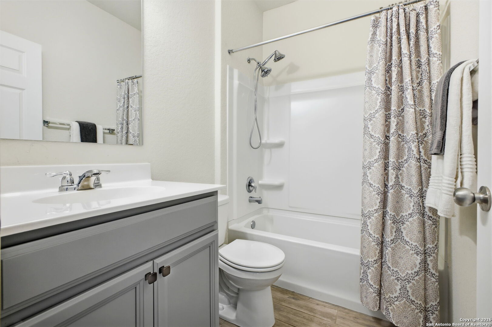 7710 Pecos Boerne, TX 78015 - Photo 25 of 34 a bathroom with a sink toilet and shower
