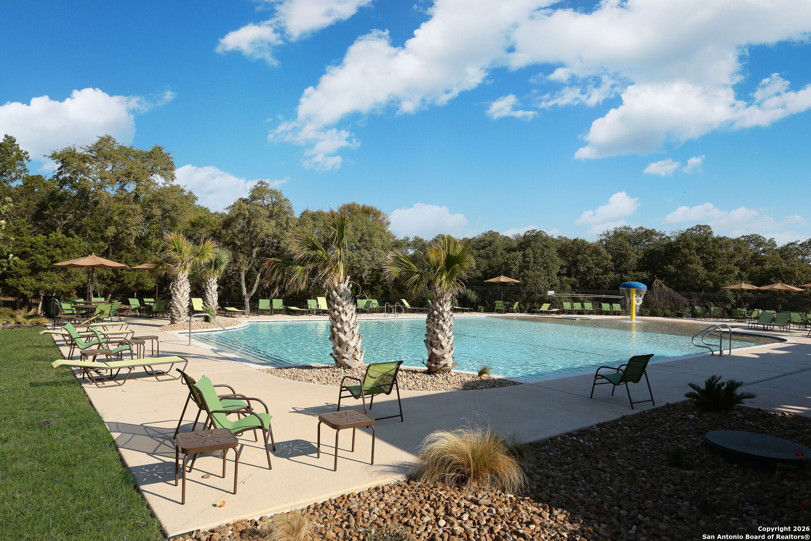 7710 Pecos Boerne, TX 78015 - Photo 34 of 34 a view of a swimming pool and lounge chairs