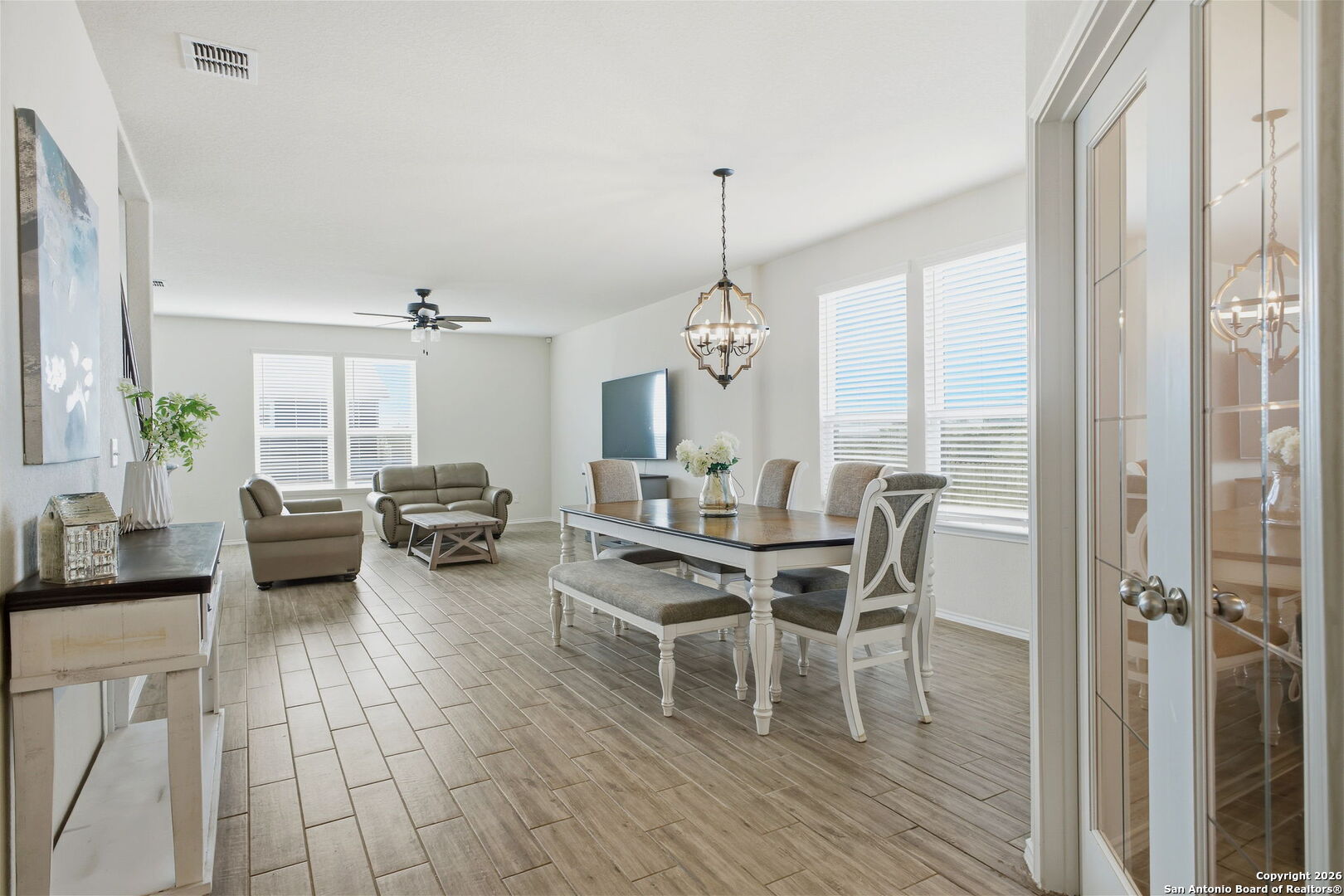 7710 Pecos Boerne, TX 78015 - Photo 8 of 34 a view of a dining room with furniture window and wooden floor