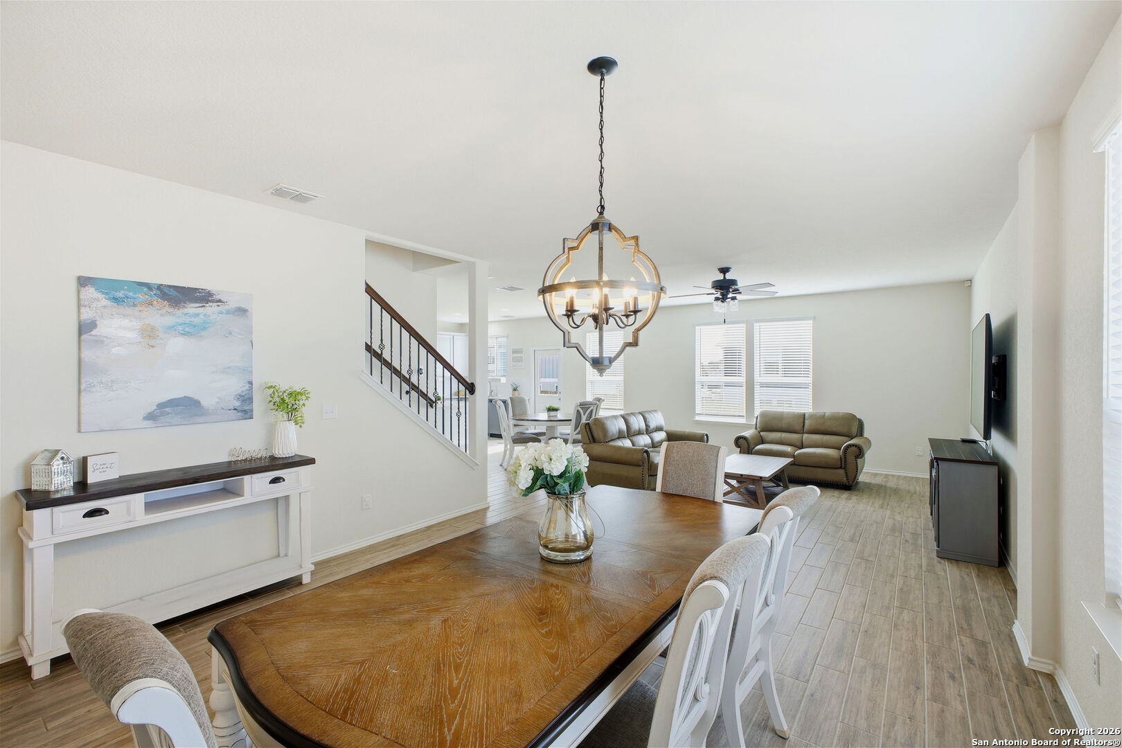 7710 Pecos Boerne, TX 78015 - Photo 9 of 34 a view of a dining room with furniture a chandelier and wooden floor