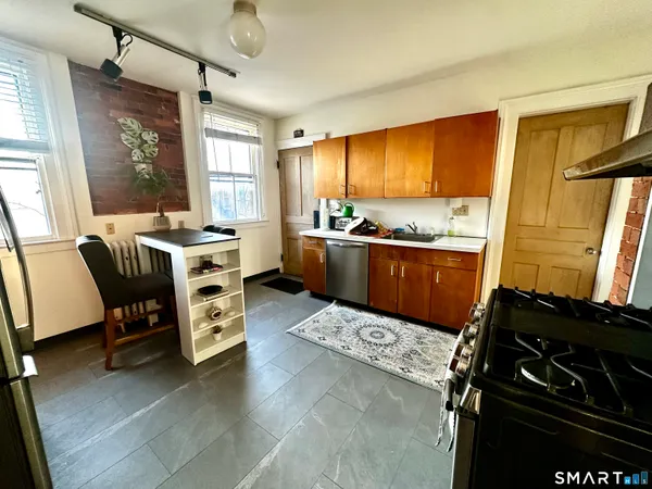 a kitchen with a stove and a table
