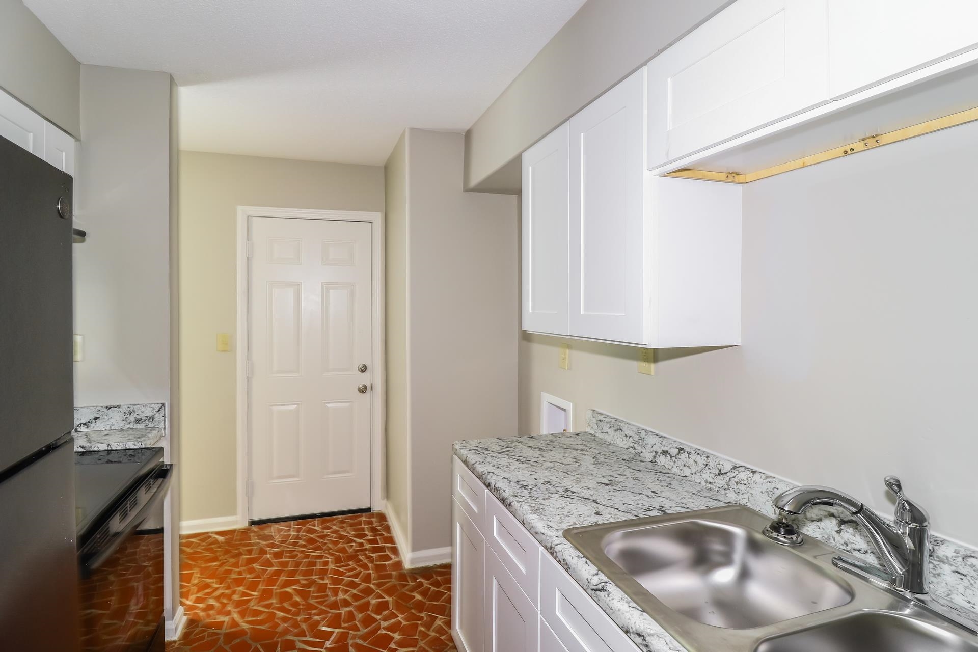 4442 Old Quarry Road Memphis, TN 38118 - Photo 6 of 16 a kitchen with granite countertop a sink and a stove