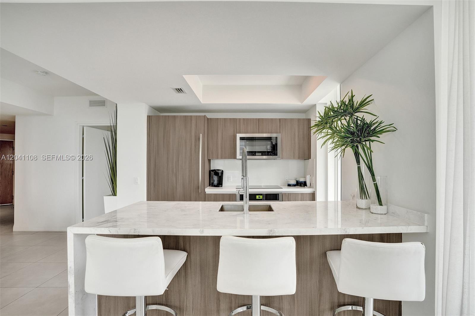 401 North Birch Road, Unit 715 Fort Lauderdale, FL 33304 - Photo 5 of 48 Breakfast bar with stools