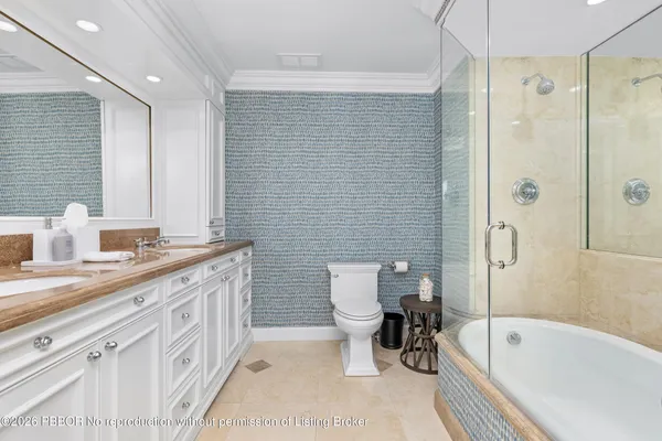 a bathroom with a tub sink and toilet