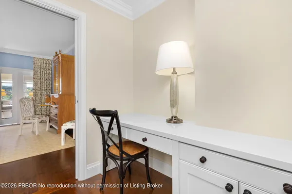 a view of a room with a table and chairs