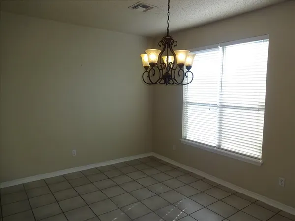 a view of a chandelier in a room and window