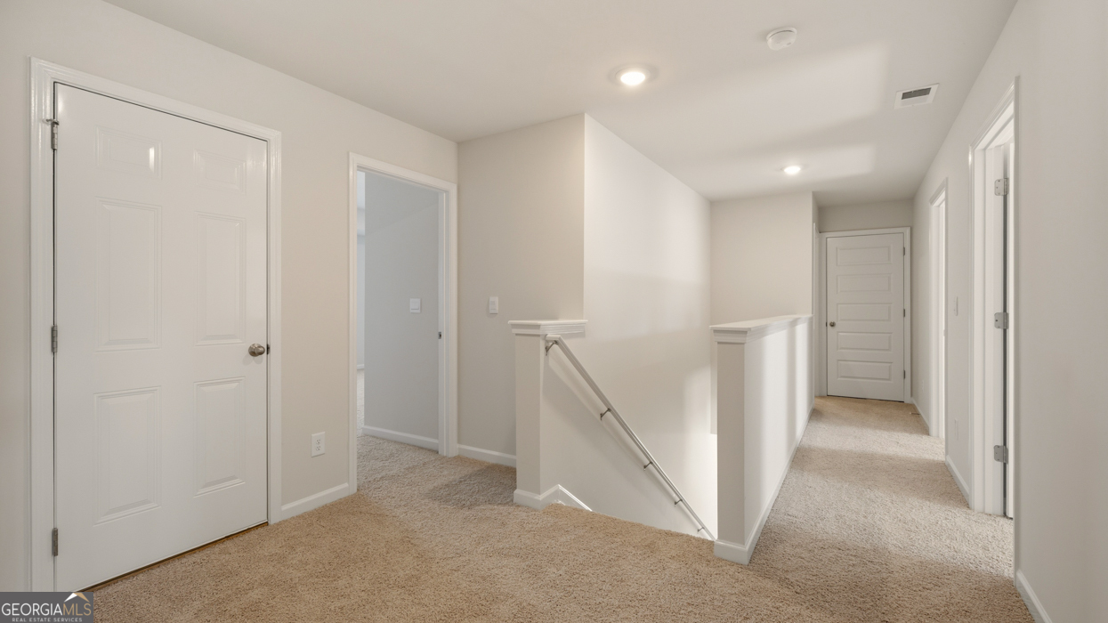 8578 Seabiscuit Road Lithonia, GA 30058 - Photo 18 of 30 a view of an empty room with a hallway
