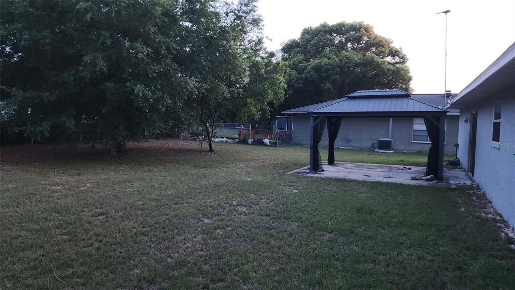 62 Silver Lane Ocala, FL 34472 - Photo 17 of 25 a view of a big yard with an outdoor space
