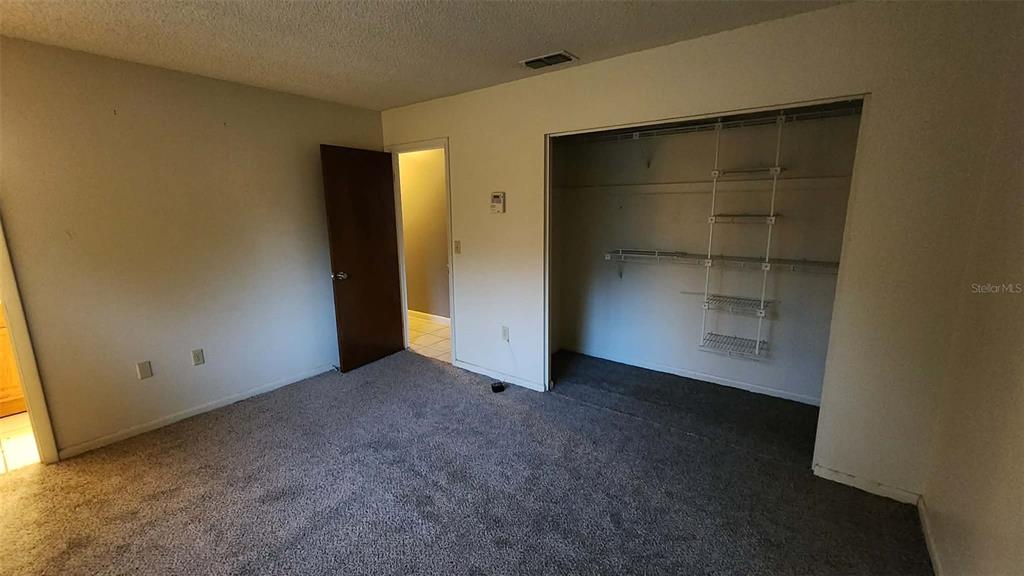 62 Silver Lane Ocala, FL 34472 - Photo 18 of 25 an empty room with a empty space and a window