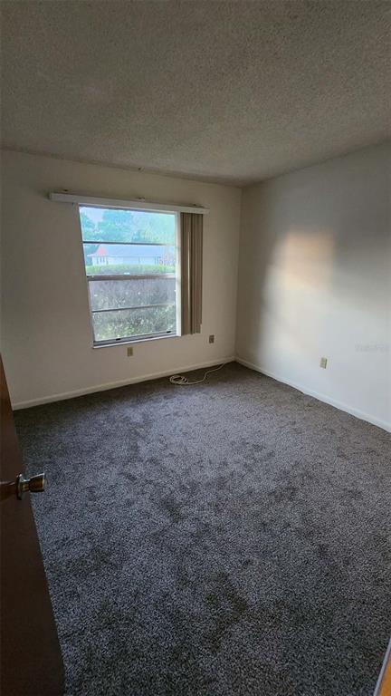 62 Silver Lane Ocala, FL 34472 - Photo 20 of 25 a view of an empty room with a window
