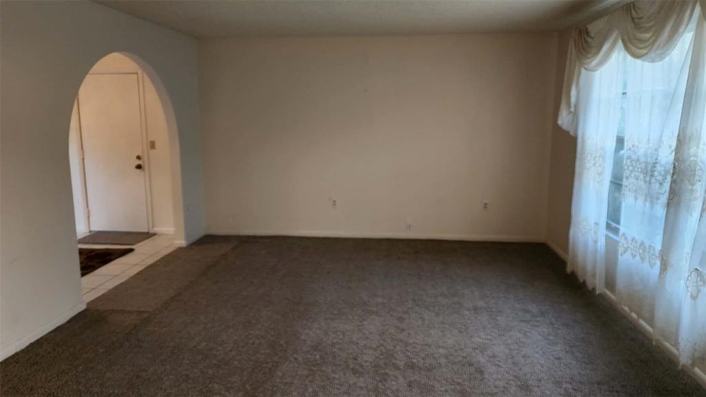 62 Silver Lane Ocala, FL 34472 - Photo 8 of 25 an empty room with a bench