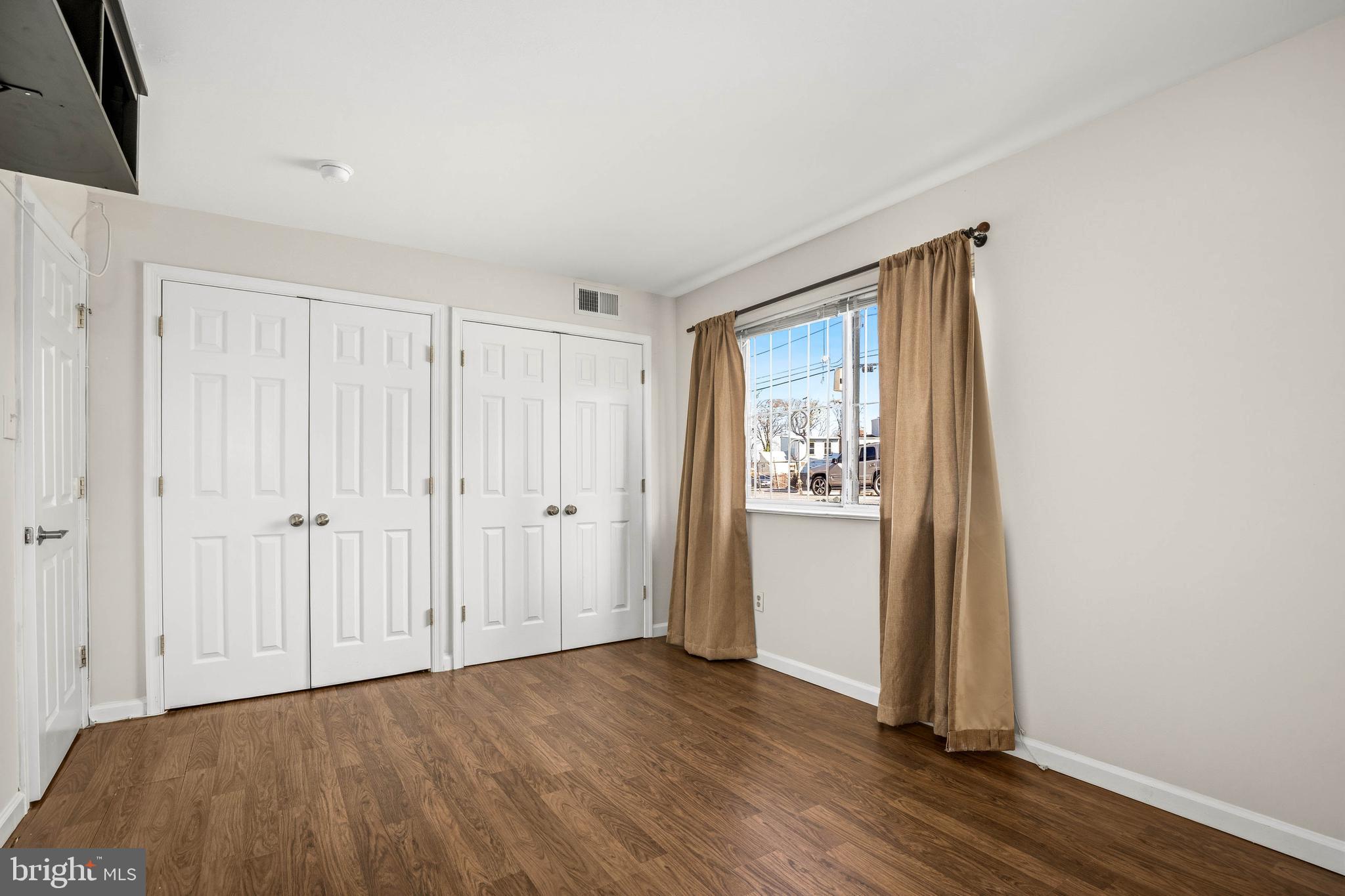 1920 Naylor Road Southeast, Unit T2 Washington, DC 20020 - Photo 15 of 25 a view of an empty room with wooden floor