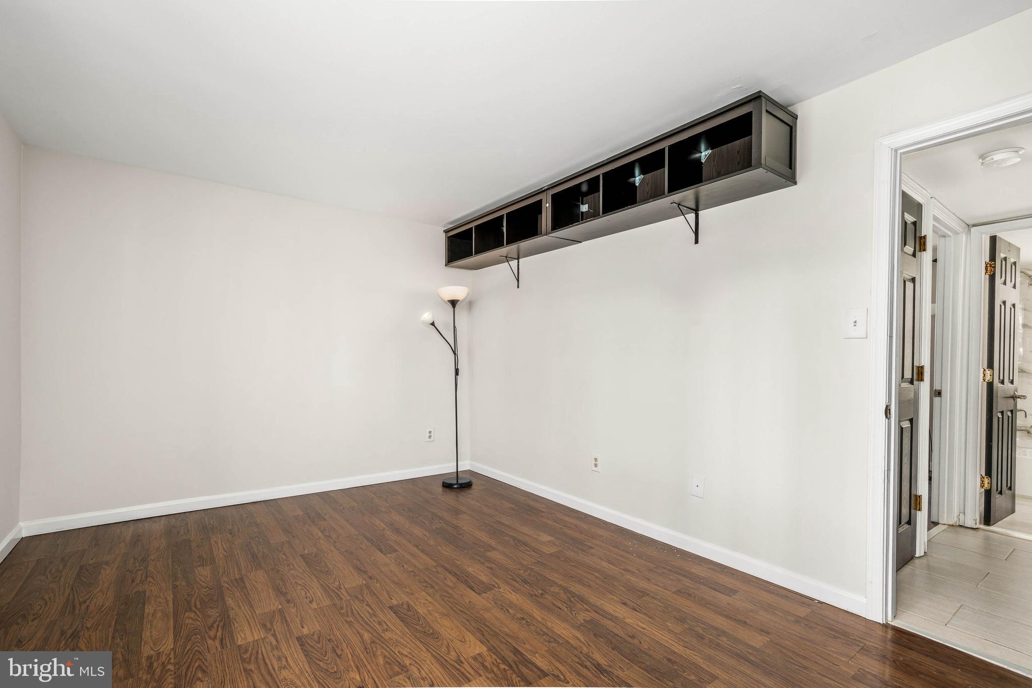 1920 Naylor Road Southeast, Unit T2 Washington, DC 20020 - Photo 16 of 25 a view of a big room with wooden floor