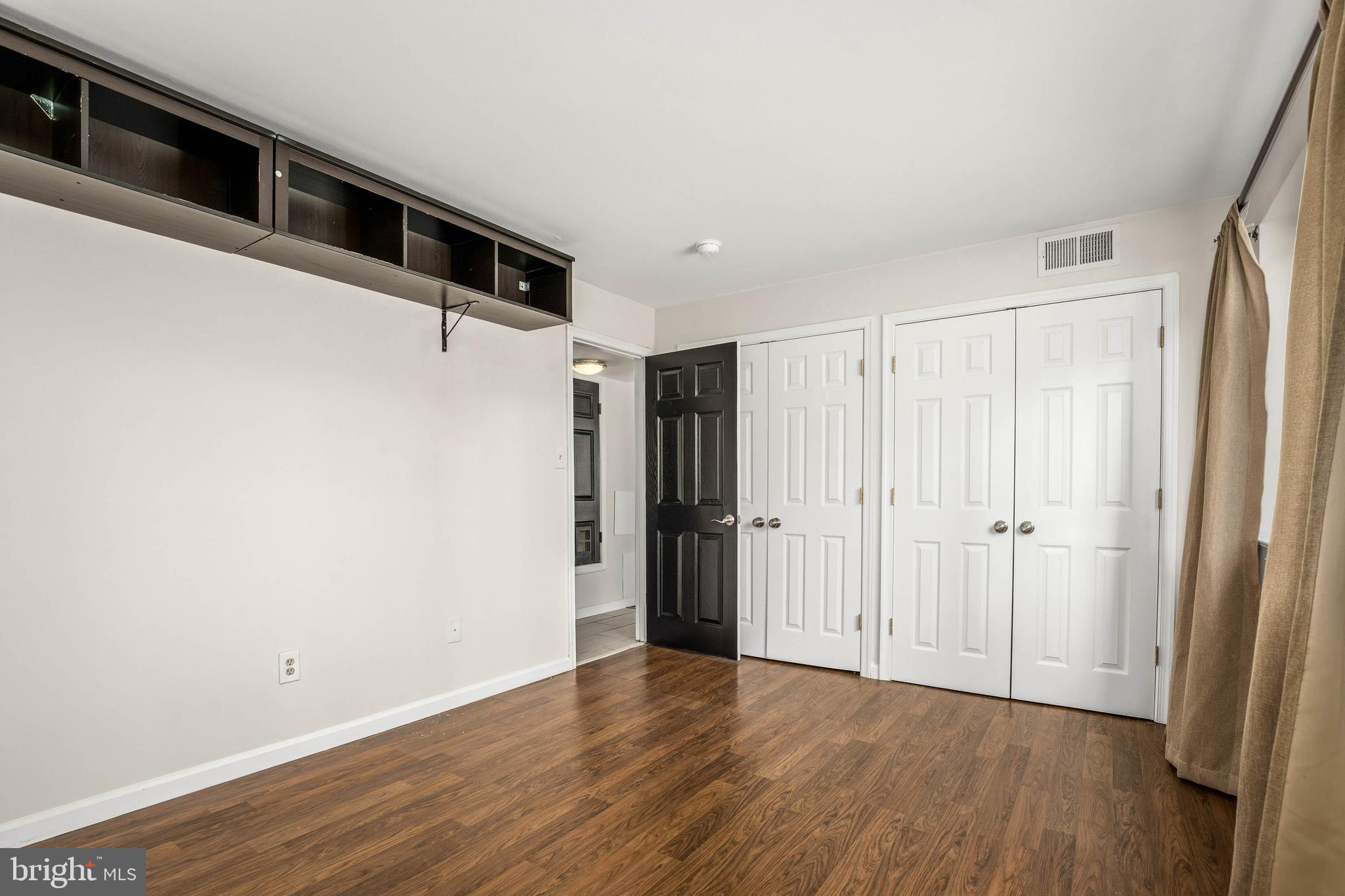 1920 Naylor Road Southeast, Unit T2 Washington, DC 20020 - Photo 17 of 25 a view of a hallway with wooden floor