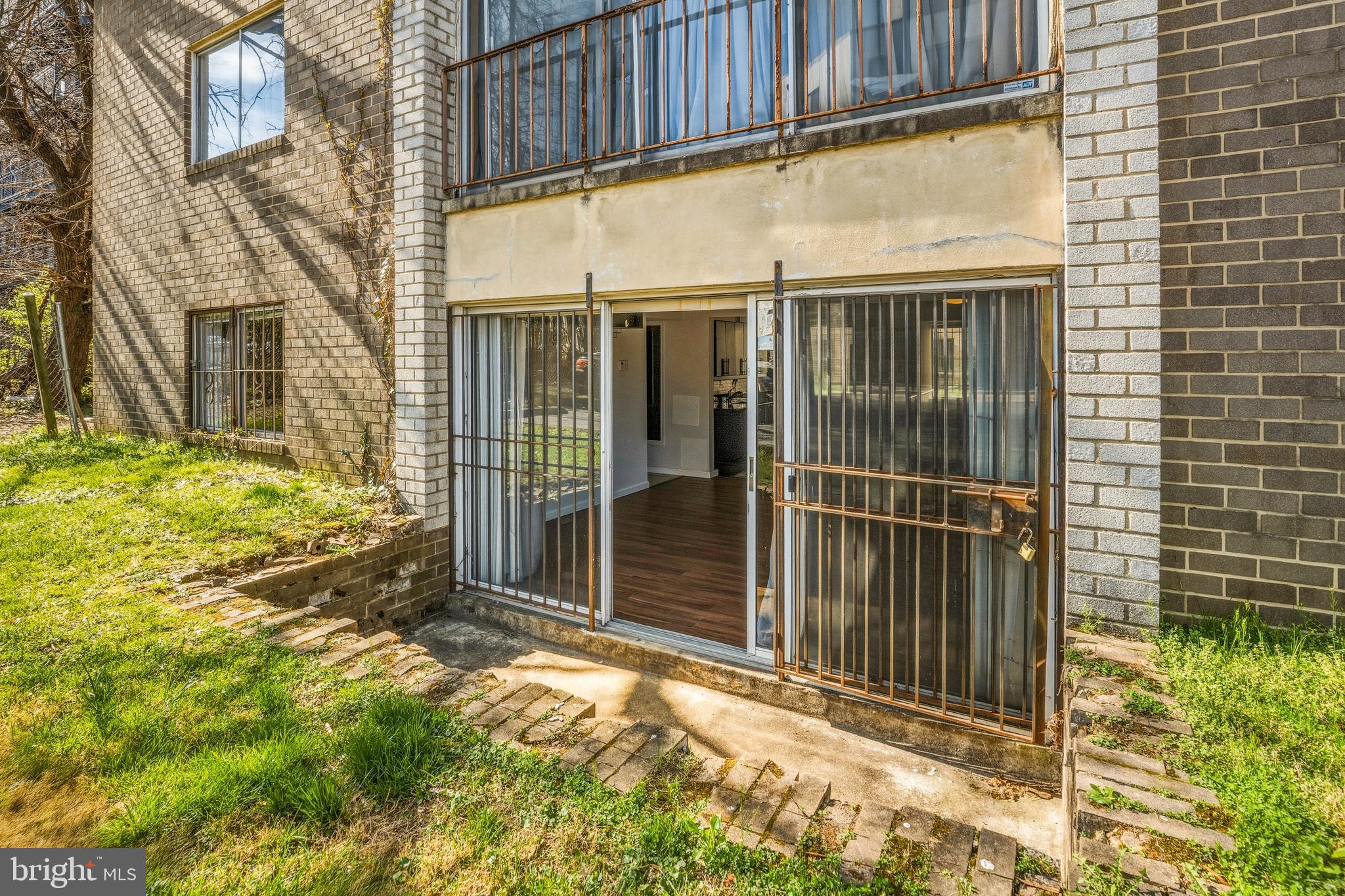 1920 Naylor Road Southeast, Unit T2 Washington, DC 20020 - Photo 23 of 25 a view of a house with a large window and wooden fence