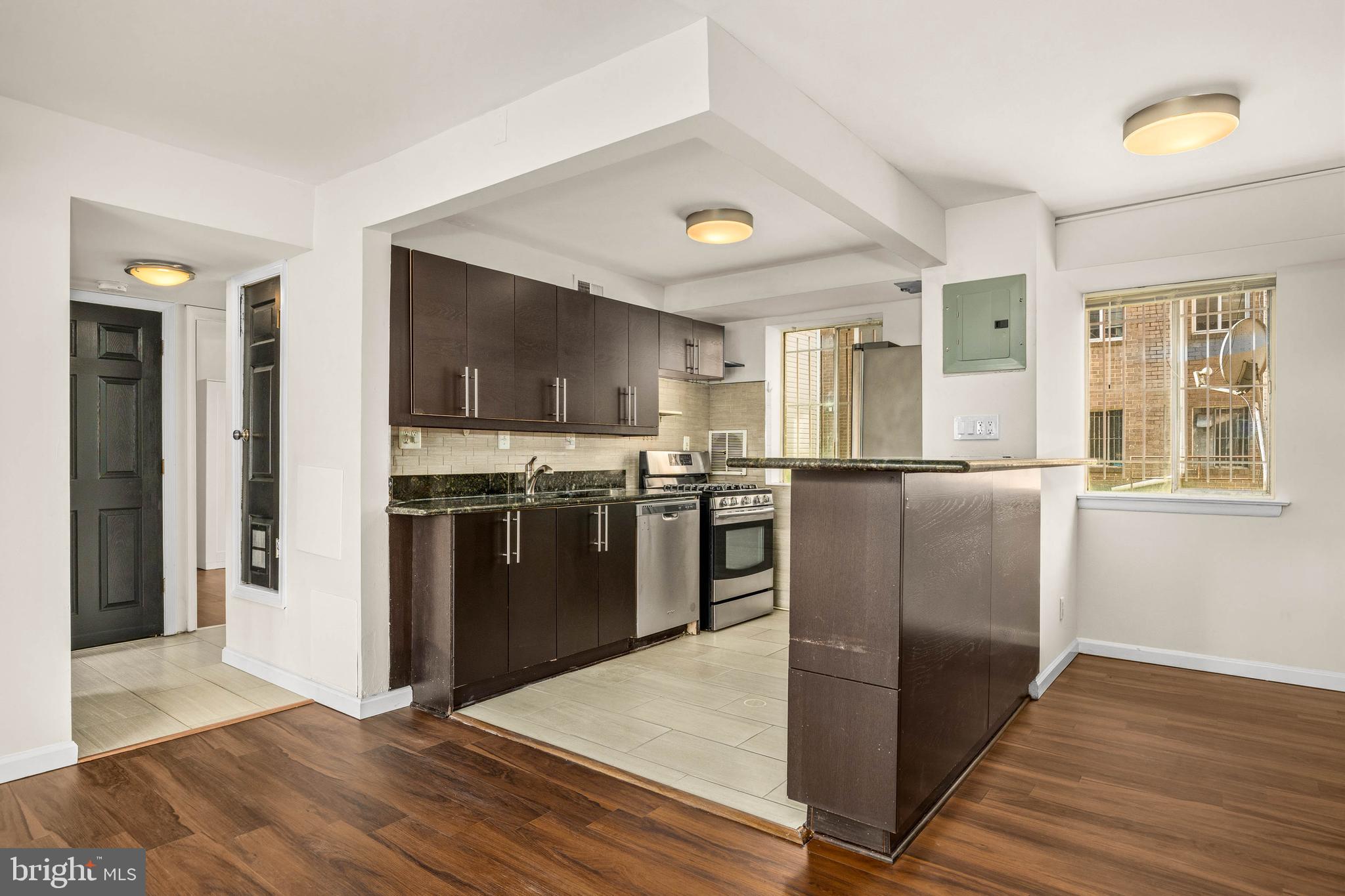 1920 Naylor Road Southeast, Unit T2 Washington, DC 20020 - Photo 9 of 25 a kitchen with stainless steel appliances granite countertop a refrigerator a stove top oven a sink and dishwasher
