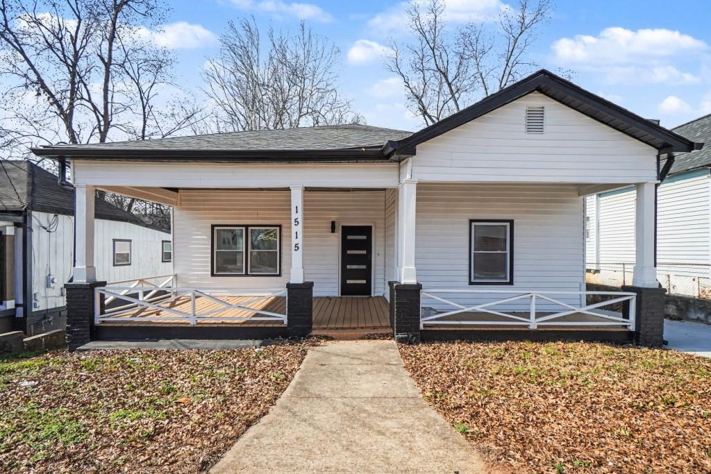 1515 Jonesboro Road Southeast Atlanta, GA 30315 - Photo 1 of 32 a front view of a house with garden