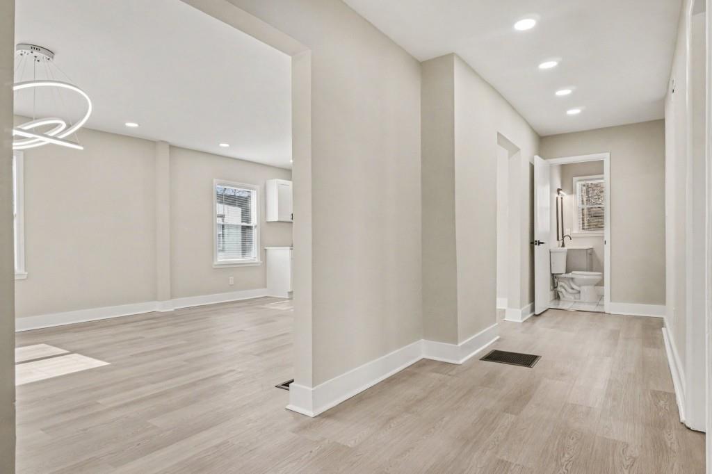 1515 Jonesboro Road Southeast Atlanta, GA 30315 - Photo 11 of 32 wooden floor in an empty room with a window
