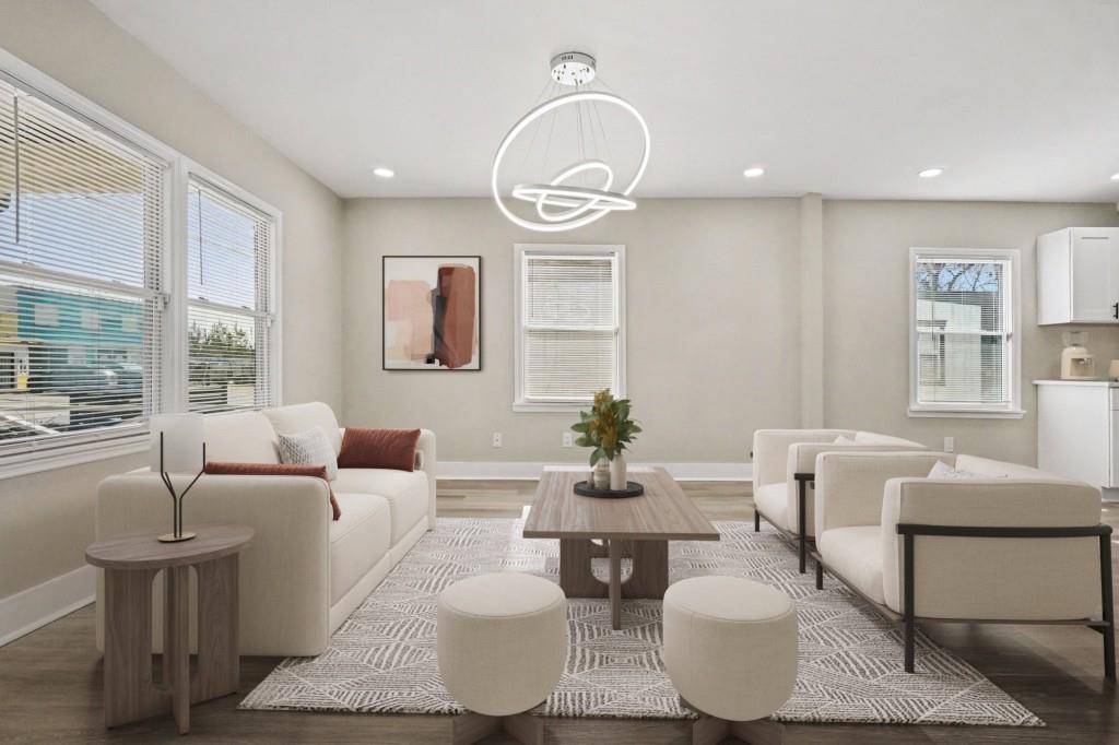 1515 Jonesboro Road Southeast Atlanta, GA 30315 - Photo 2 of 32 a living room with furniture a table and a large window