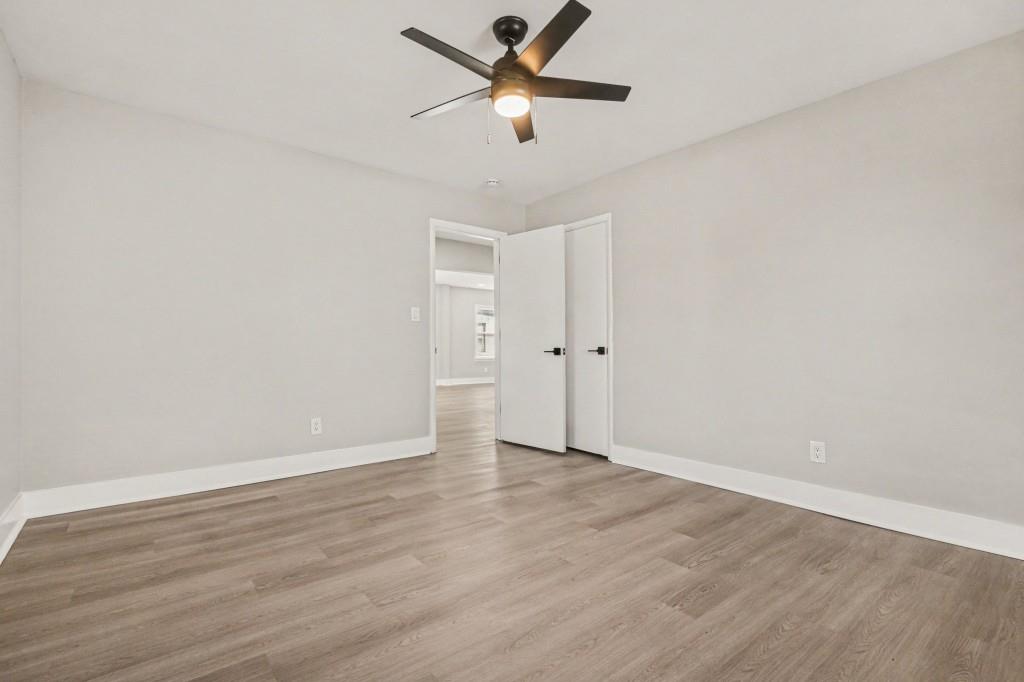 1515 Jonesboro Road Southeast Atlanta, GA 30315 - Photo 23 of 32 wooden floor in an empty room