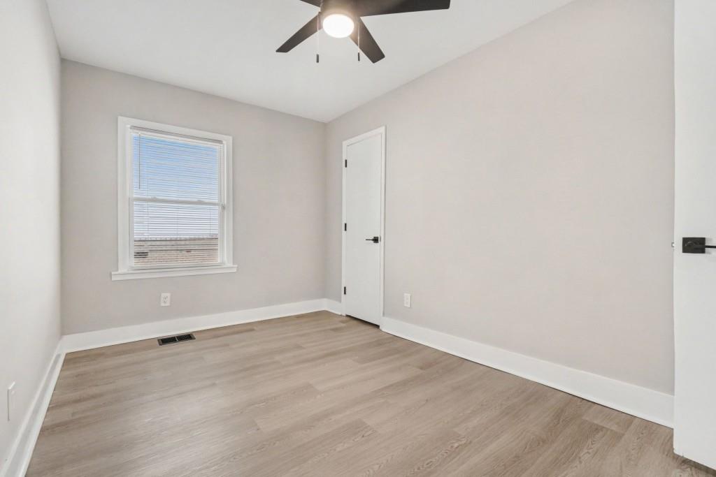1515 Jonesboro Road Southeast Atlanta, GA 30315 - Photo 25 of 32 an empty room with a empty space and windows