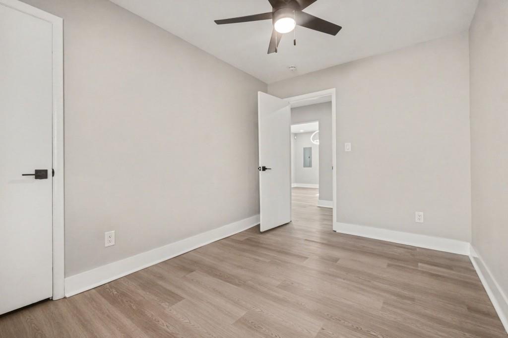 1515 Jonesboro Road Southeast Atlanta, GA 30315 - Photo 26 of 32 a view of an empty room with wooden floor