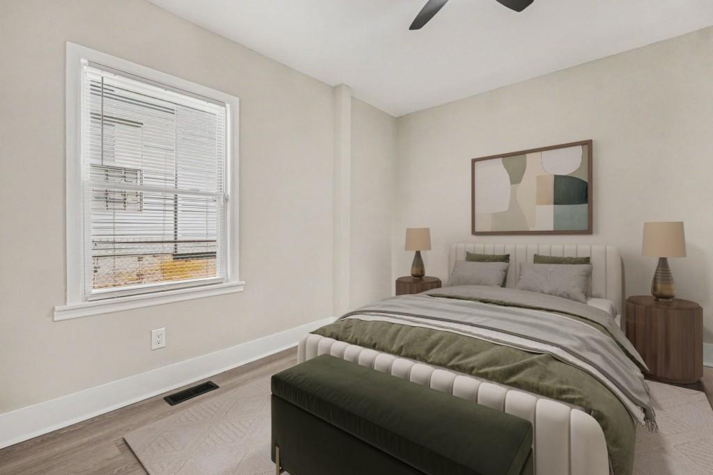 1515 Jonesboro Road Southeast Atlanta, GA 30315 - Photo 4 of 32 a bedroom with a bed and a window